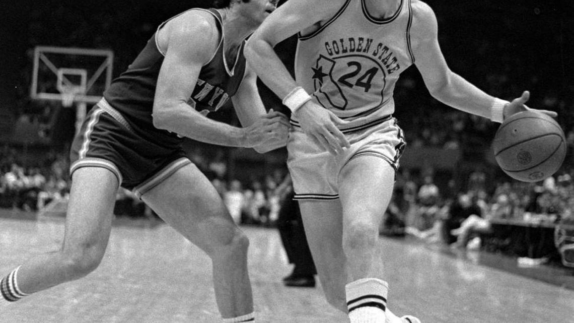 Golden State Warriors Rick Barry (24) drives past the New York Knicks Dave DeBusschere (22) in this file photo taken in Oakland, Calif. March 14, 1974. (AP Photo/Sal Veder)