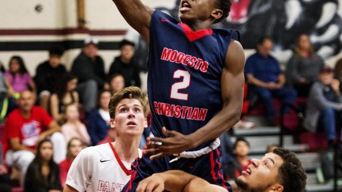 Modesto Christian’s Michael Pearson streaks through the Modesto defense for a score during a game at Modesto High School in Modesto, Calif., on Wednesday, Jan. 11, 2017. The freshman point guard will miss the rest of the season with a foot fracture.