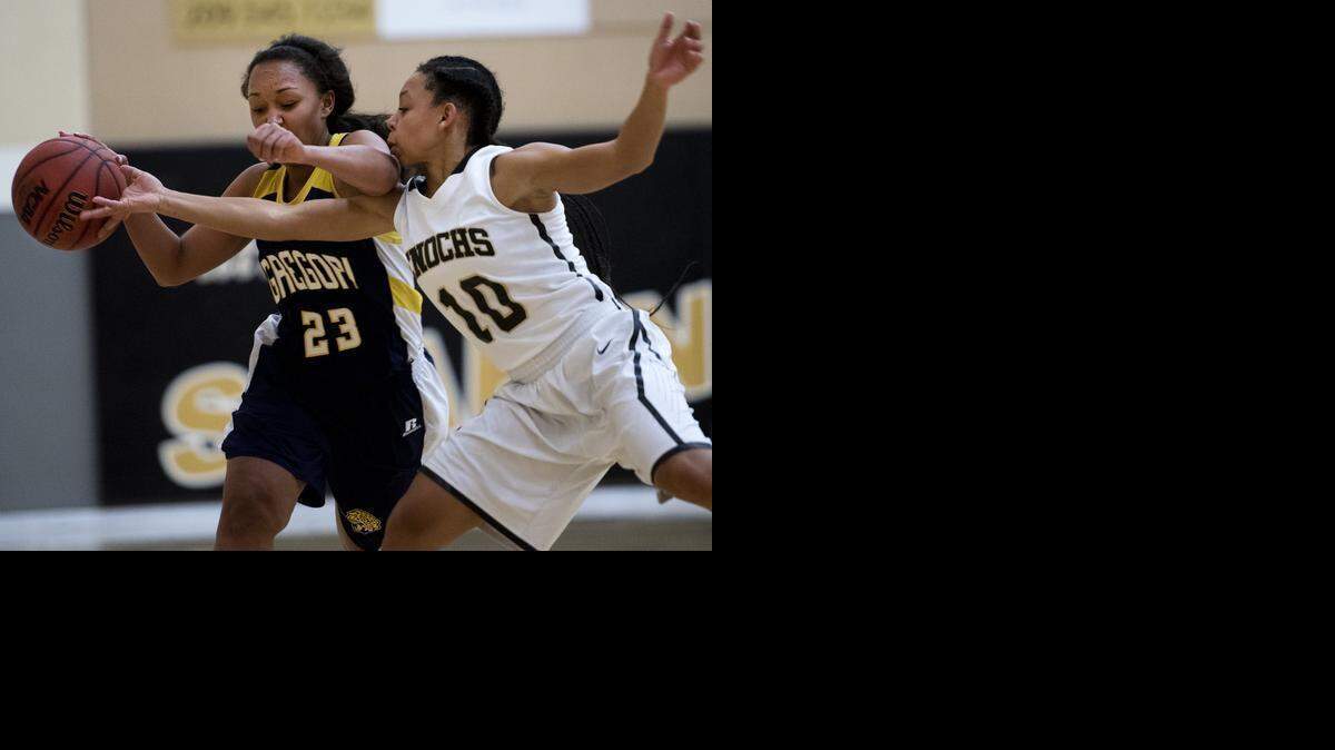 Enochs’ Zakiya Williams knocks the ball loose from Gregori’s Mariah McDuffy during a Modesto Metro Conference game.