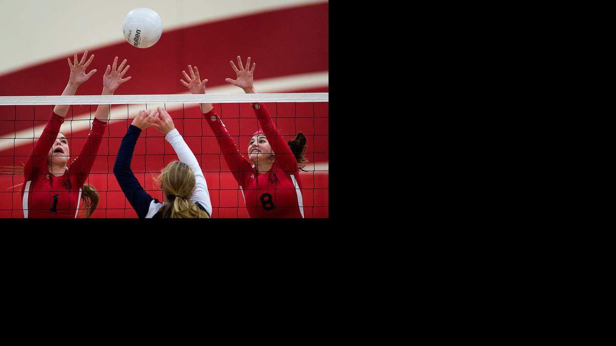 
Central Catholic's Jessica Limbaugh tries to float the ball over Ripon's Breana Barrios, left, and Shannon Wesley during the D4 Sac Joaquin Section playoff game at Ripon High School in Ripon, Calif., on Tuesday, November 11, 2014. Ripon won the match 25-16, 25-20, 25-13.
