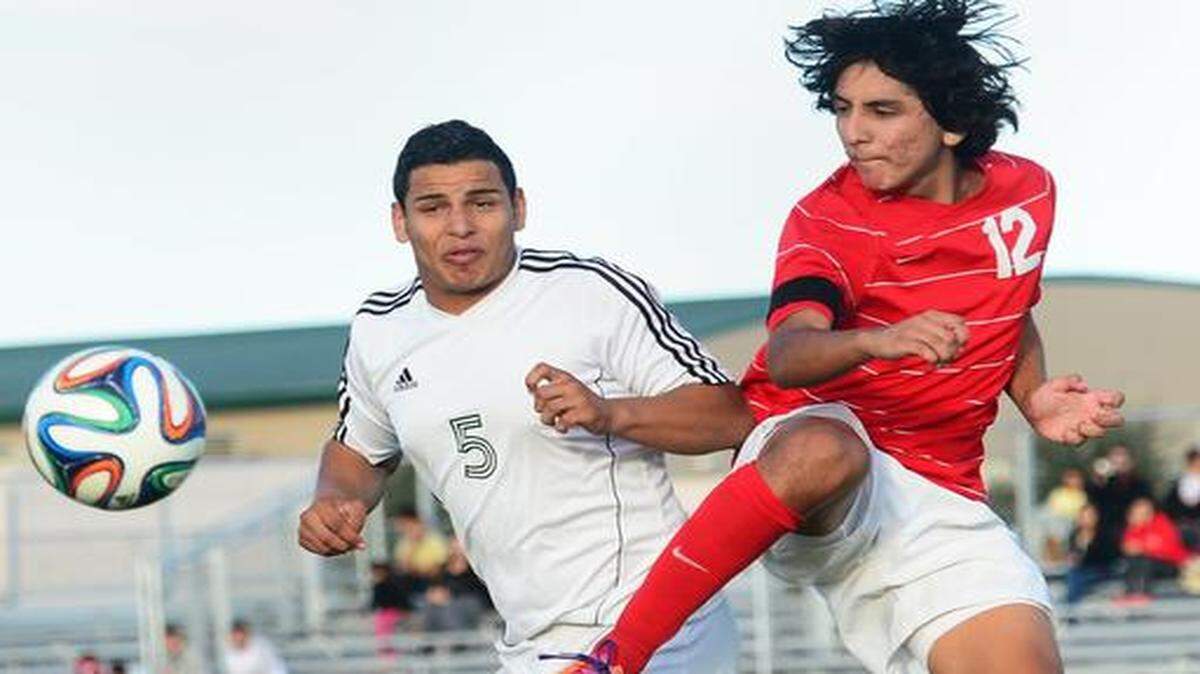 
Victor Yepez, of Central Valley and Jordy Corral of Patterson collide in efforts to control the ball in Western Athletic Conference league soccer at Central Valley soccer fields, Oct. 27, 2014.
