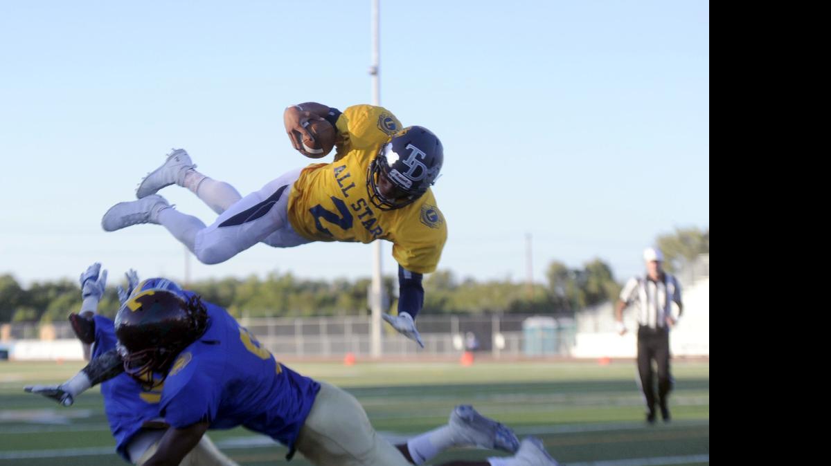 
Downey quarterback, PJ wilson takes flight to score on a two point conversion for the South Team during the Lions All-Star Football Game where the South defeated the North 51-38 at Tracy High's Wayne Schneider Stadium in Tracy on June 13th, 2015.
