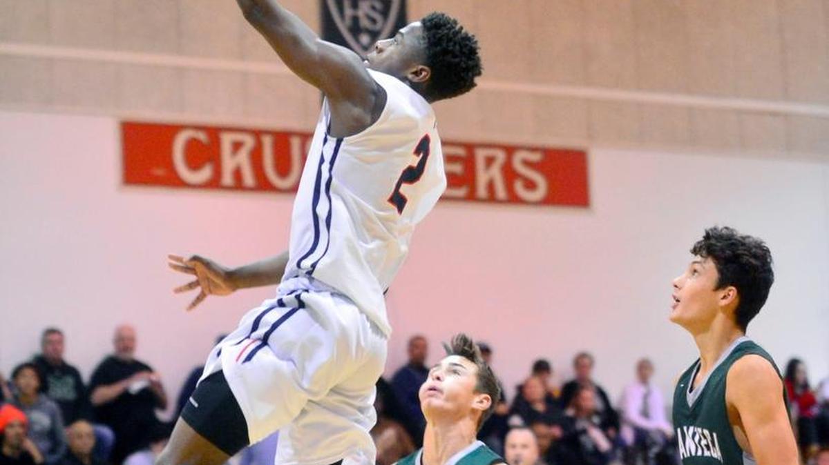 Modesto Christian’s Michael Pearson (2) goes up for a fast-break layup during the third-place game in which the Crusaders defeated Manteca 63-48 at the Modesto Christian Hoops Holiday Classic on Dec. 30, 2016.