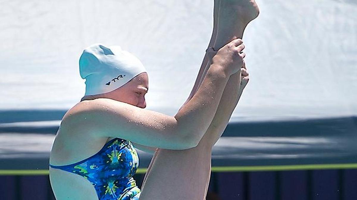 
Pitman diver Natasha Sondeno makes a dive during the Girls South Sac-Joaquin Section diving finals at Johansen High in Modesto on May 9.
