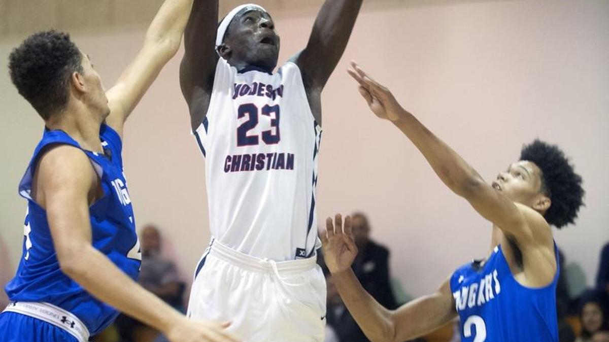 Modesto Christian Forward Robinson Idehen goes up for a dunk during a game between Modesto Christian and Capital Christian at Modesto Christian High School in Modesto California on February 6, 2016.