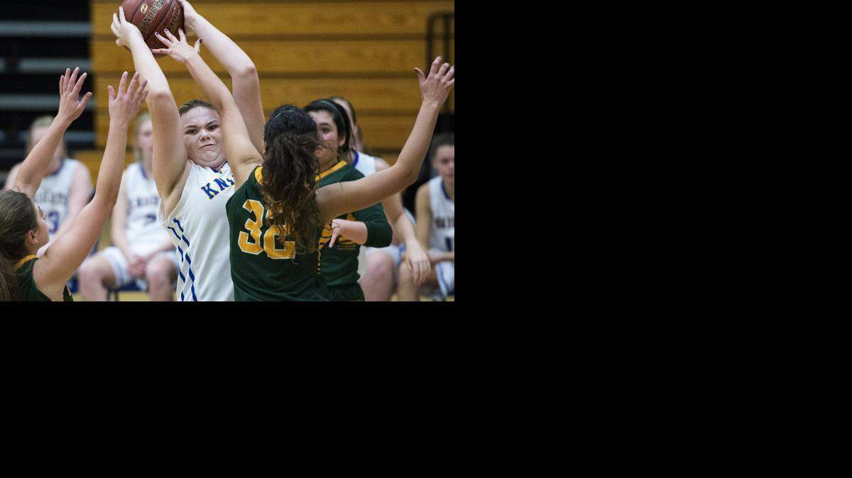 
Ripon Christian center Pamela Radach looks to pass under pressure from San Domenico defense during the CIF Division V playoff game in Ripon, Calif., on Wednesday, March, 11, 2015. San Domenico won the game 38-16.
