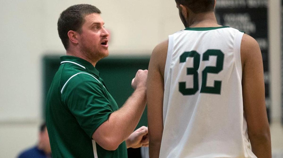 Manteca coach Brett Lewis talks with center Anand Hundal (32) during a game between Manteca and Central Catholic at Manteca High School in Manteca, Calif., on Jan. 22, 2016.
