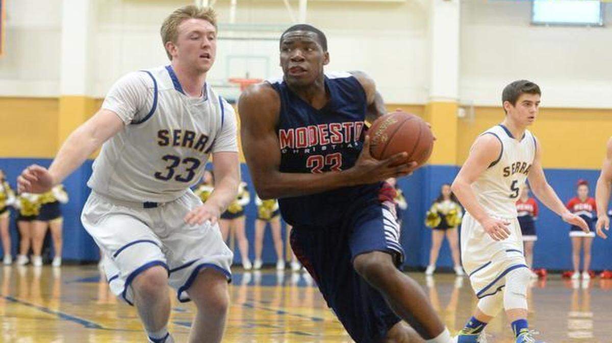 
Modesto Christian’s Anthony Townes drives against Serra in the Crusaders’ 53-48 win in their Open Division semifinal Tuesday.


