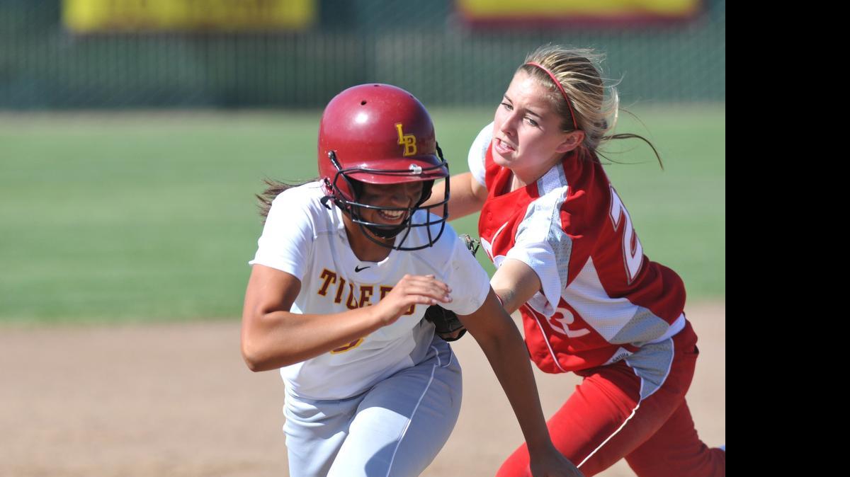 
Ceres shortstop Nicole Bates tags Los Banos baserunner Melanie Silva in a 2013 game. Bates was named WAC’s Offense Player of the Year this season.
