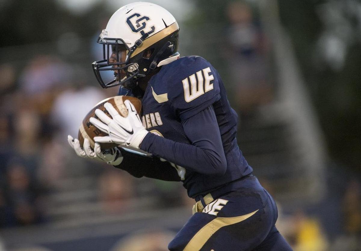Central Catholic receiver DaRon Bland hauls in a pass for a 64-yard touchdown during a non-conference game with Atwater in Modesto, Calif., on Friday, September, 4, 2015. Central Catholic won the game 49-0.