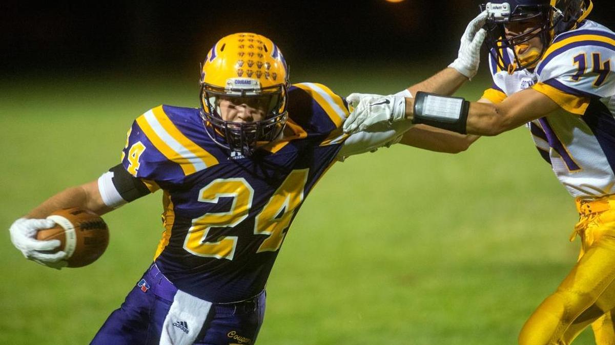 
Escalon running back Hunter Calton stiff arms Bret Harte defender Zeke Renner during a game between Escalon and Bret Harte at Escalon High School in Escalon California on September 14, 2015.
