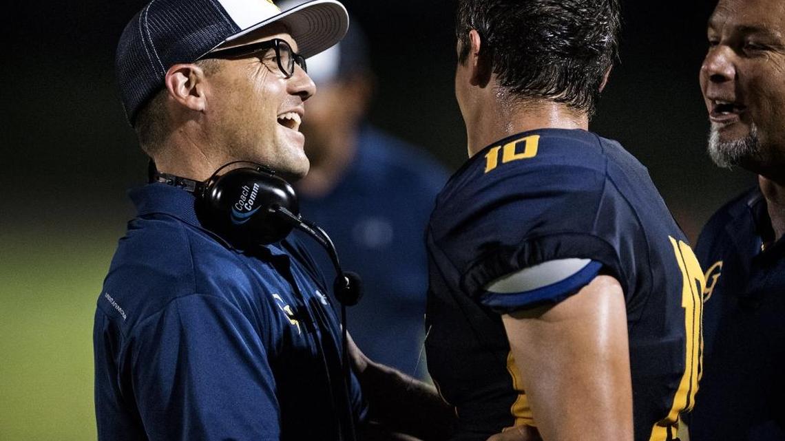 Gregori coach Jason McCoy congratulates quarterback Bobby Avina after a touchdown pass during Friday's game at Gregori High School in Salida, Calif., on Sept. 1, 2017.