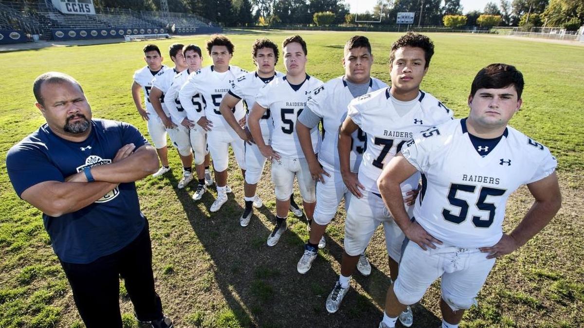 Central Catholic High offensive line coach Billy Hylla, left, with the linemen, from right, Brandon Williamson, Steven Jackson, Andrew Buenrostro, Joshua Bodenschatz, Austin Cook, Myles Fry, Mark Henriques, Chris Mendoza and Ricky Soto, in Modesto, Calif., on Thursday, November 17, 2016.