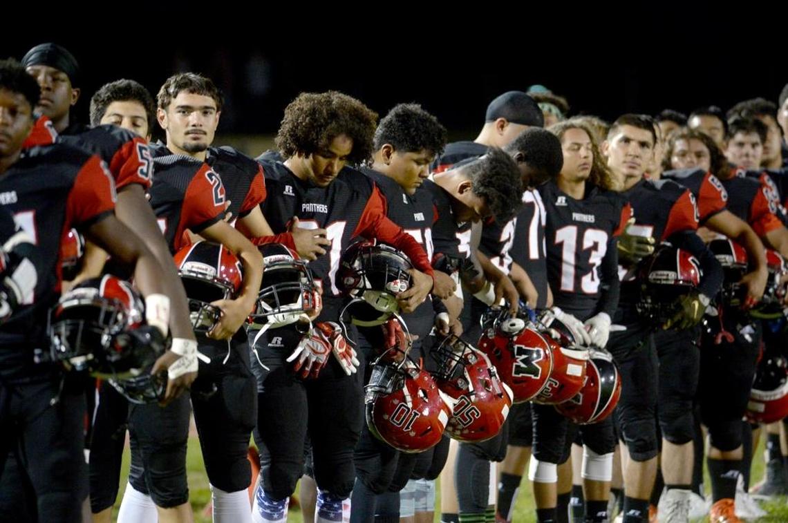 No players knelt during the national anthem, however a few players turned and bowed their heads during the pre-game ritual, during the Modesto High homecoming football game against Davis High, at Gregori's Don Lanphear Stadium, Friday, September 29, 2017 in Salida, Calif.