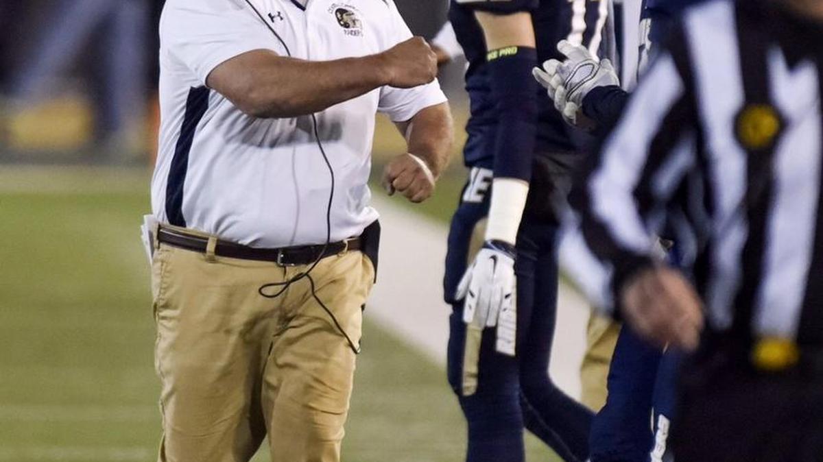 Central Catholic coach Roger Canepa pumps his fist after a interception and touchdown during the CIF Open Division Small School championship with San Marino at California State University, Sacramento in Sacramento, Calif., on Saturday, Dec. 19, 2015.