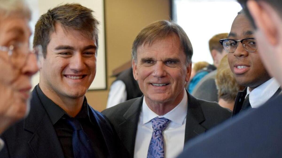 Legendary De La Salle football coach Bob Ladouceur was the keynote lunchtime speaker at Sierra Vista Child and Family Services’ third annual Regional Mentoring Summit, held Friday, Jan. 22, 2016, at California State University, Stanislaus, in Turlock. Here he meets with memebers of Central Catholic’s state championship football team, including All-American linebacker Kekupa’a Freehauf, left, and a All-Stanislus District linebacker Montell Bland, right.