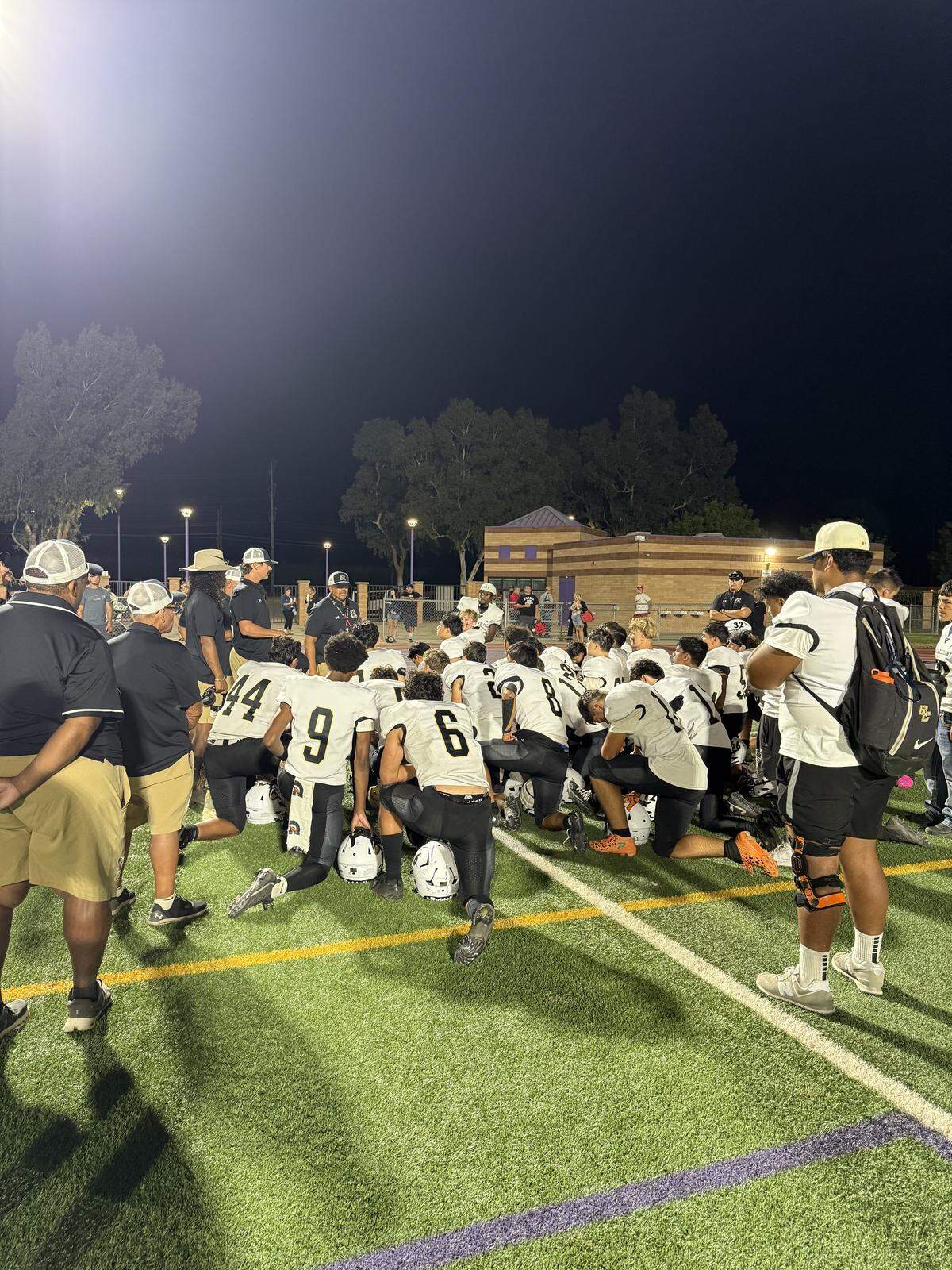 Buhach Colony players listen to coaches postgame after their 27-6 loss to Johansen. The Thunder fell to 0-2 on the season.