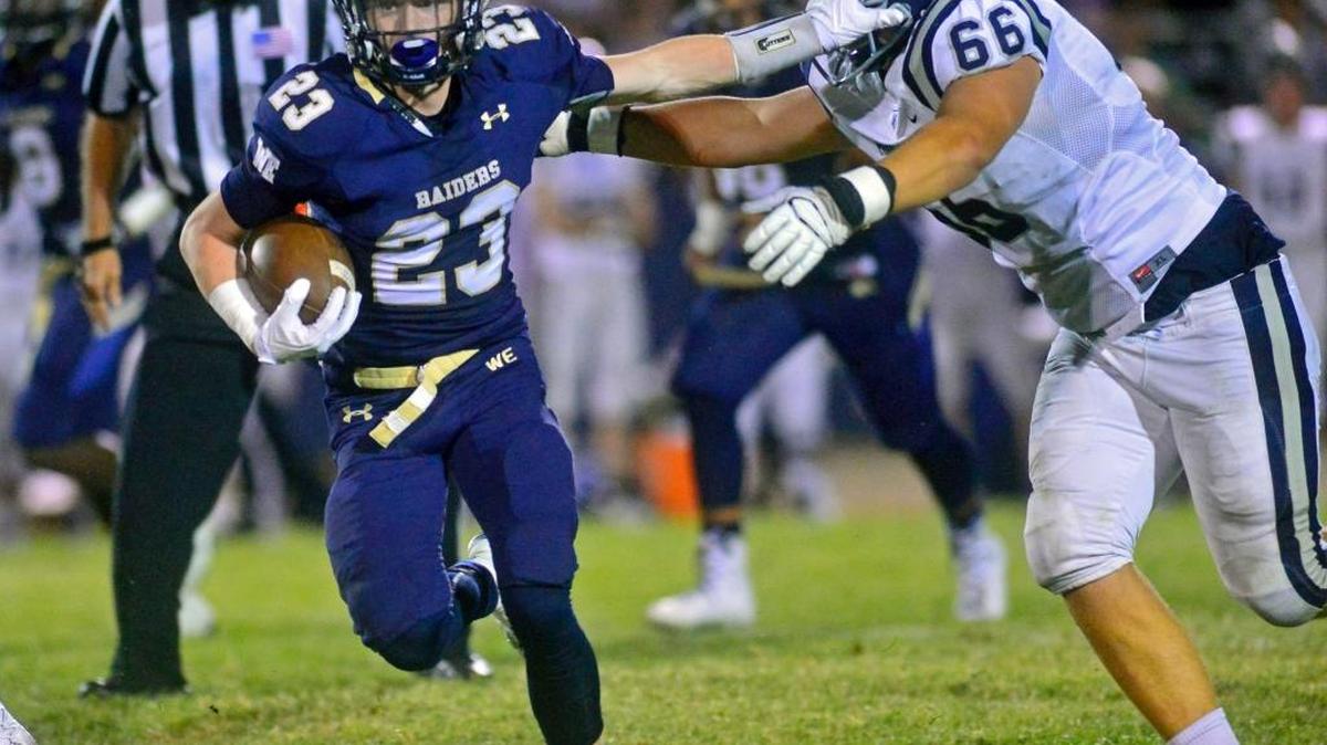Central Catholic running back Jared Rice stiff-arms a defender during a game between Central Catholic and Marin Catholic in Modesto on Aug. 26, 2016.