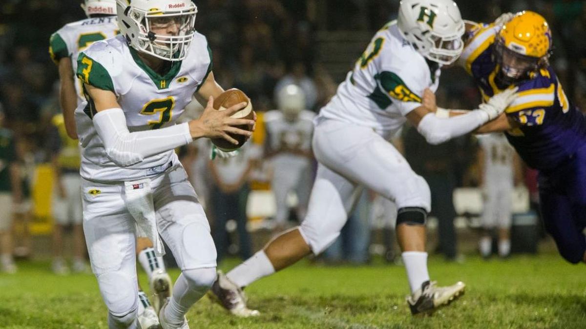 Hilmar High’s Chase Kindberg (3) looks for an open man during play against Escalon High Football at Escalon High Friday Oct. 7th 2016.