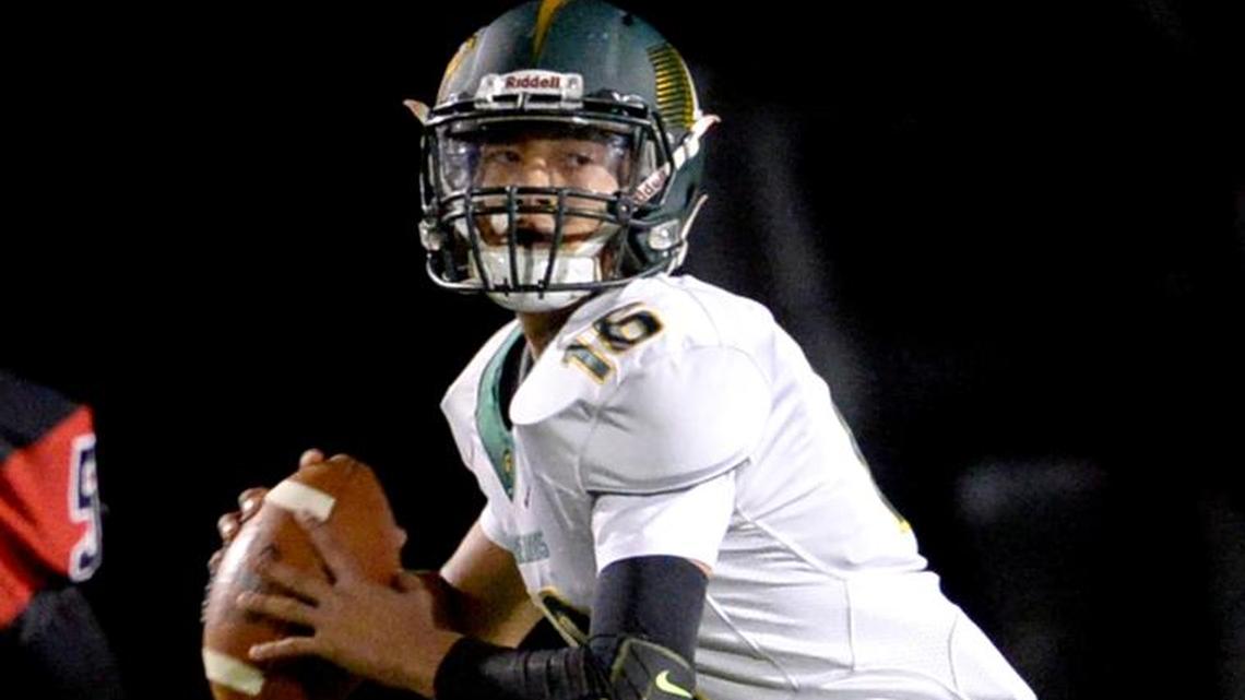 Davis High quarterback Xavier Rodriguez (16) looks to throw a pass, during the Modesto High homecoming football game against Davis High, at Gregori’s Don Lanphear Stadium, Friday, September 29, 2017 in Salida, Calif.