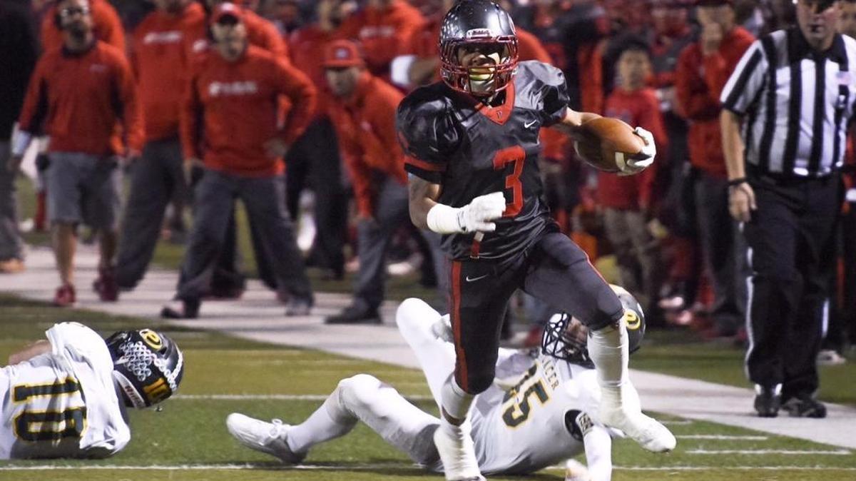 Patterson runningback Michael Lawson breaks free for a 21-yard touchdown during the Sac-Joaquin Section Division III quarterfinal playoff game with Placer in Patterson, Calif., on Friday, Nov. 20, 2015.