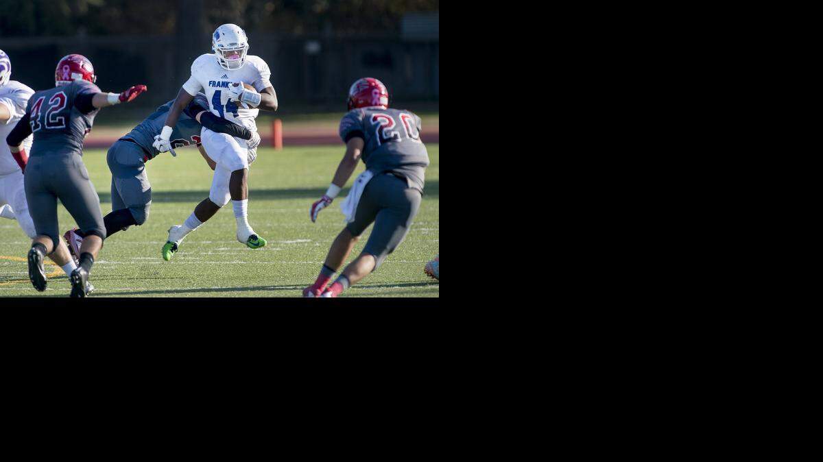 
Modesto defensive end Will Gallo puts a stop on Franklin fullback Rahsaan York during the Sac-Joaquin Section Division I playoff game at Downey High School in Modesto, Calif., on Saturday, November. 15, 2014. Franklin won the game 24-10.
