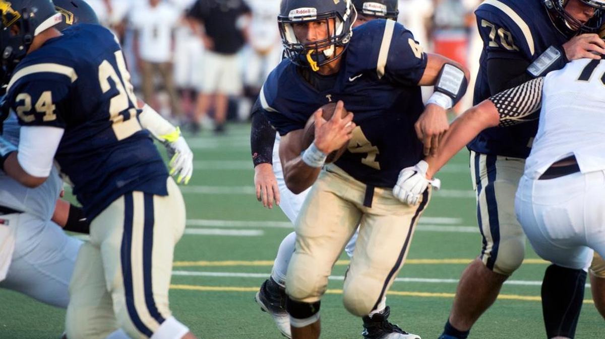 Turlock junior Danny Velasquez scores against Enochs on Aug. 28, 2015. Velasquez is sharing the Central California Conference’s Most Valuable Player award with Merced receiver A.J. Stewart.
