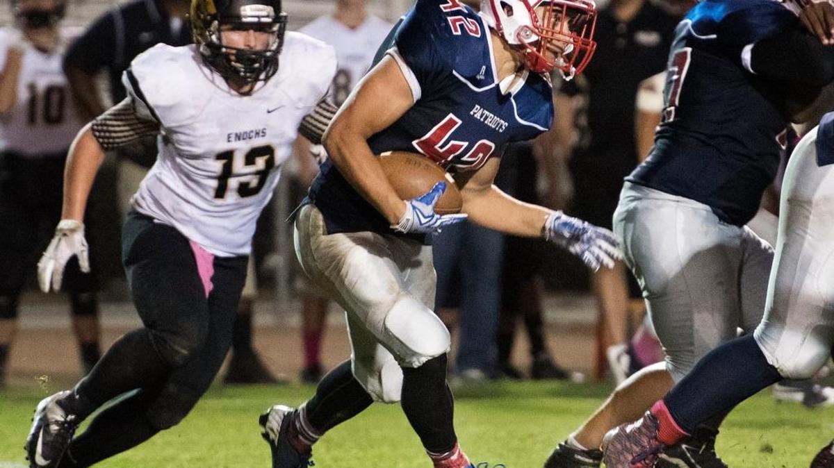 Beyer running back D.J. Jackson looks for a hole in the line during the Modesto Metro Conference game with Enochs at Johansen High School in Modesto, Calif., on Friday, Oct. 9, 2015. Jackson will likely get the carries Modesto Metro Conference MVP Jay Green had last season. Green graduated in 2016.
