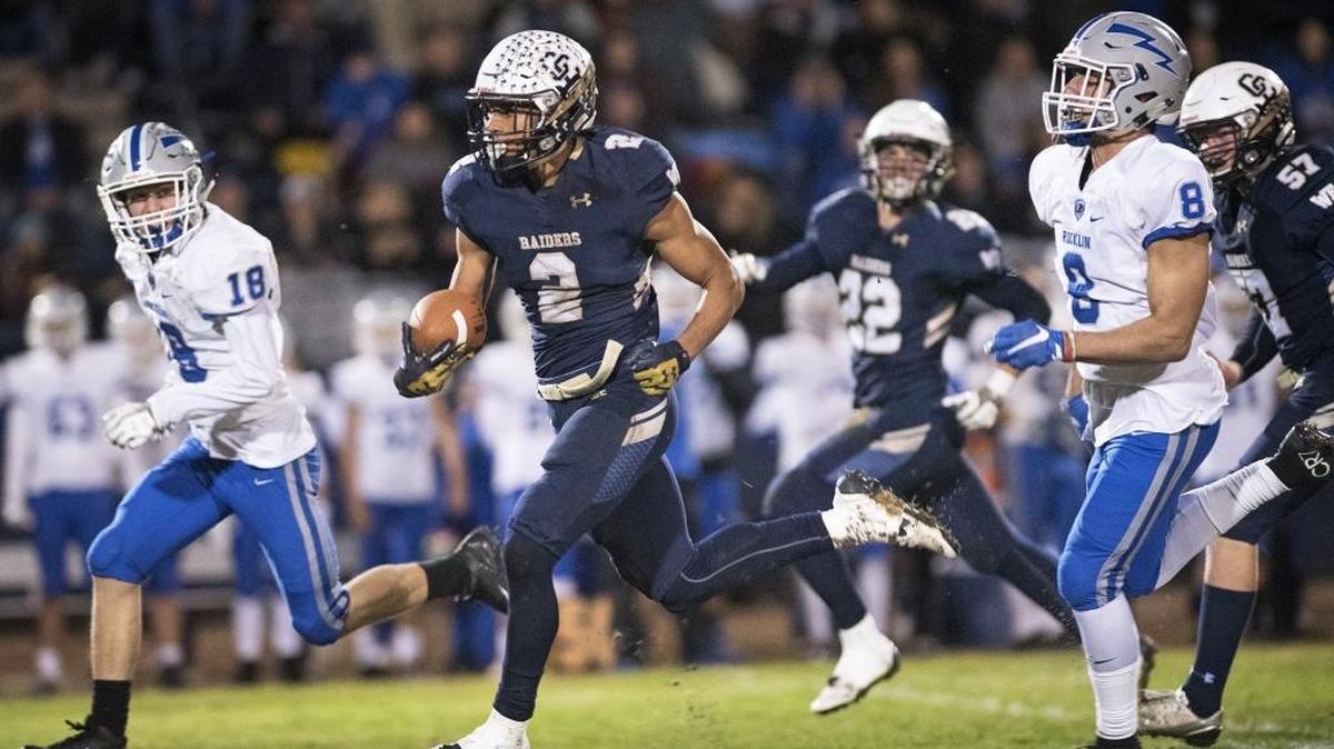Central Catholic's Dauson Booker returns a kickoff for 93 yards and a touchdown during the Sac-Joaquin Section Division II playoff game with Rocklin at Central Catholic High School in Modesto, Calif., on Friday, Nov. 17, 2017.