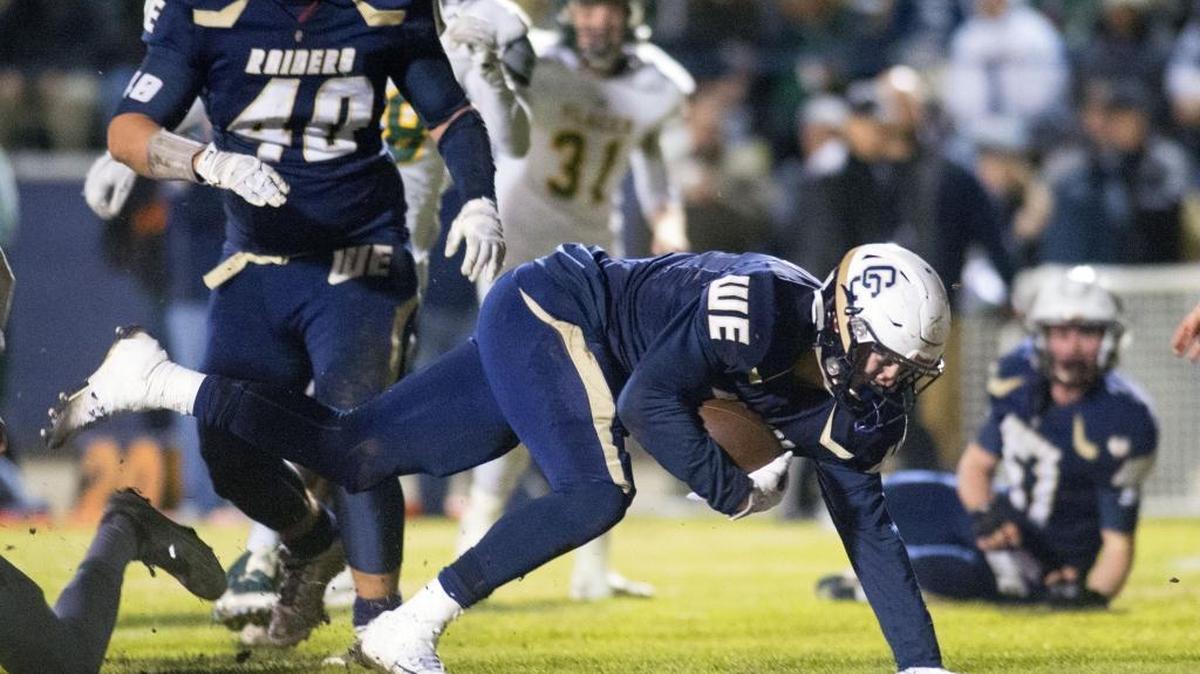 Central Catholic running back Justin Rice (2) balances himself before scoring a touchdown during a San-Joaquin Division III playoff game between Central Catholic and Placer, where Central Catholic won 48-14, in Modesto California on November 27, 2015.
