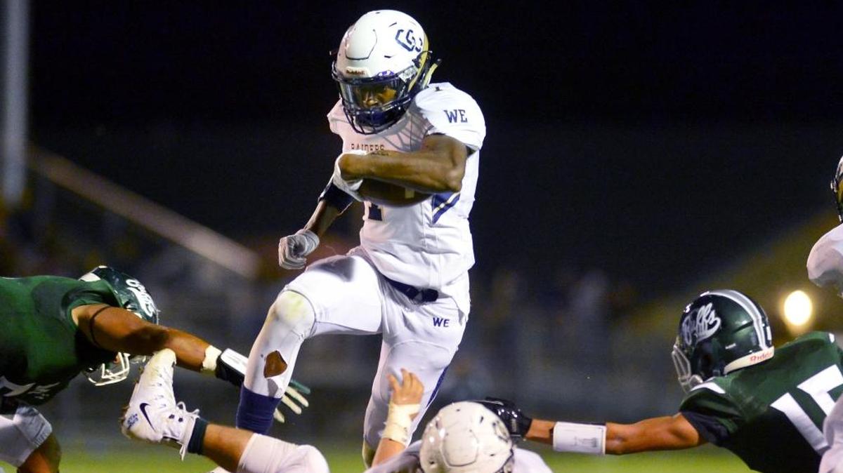 Central Catholic running back Dawaiian McNeely (7) leaps over a blocker during a game last season against Manteca.