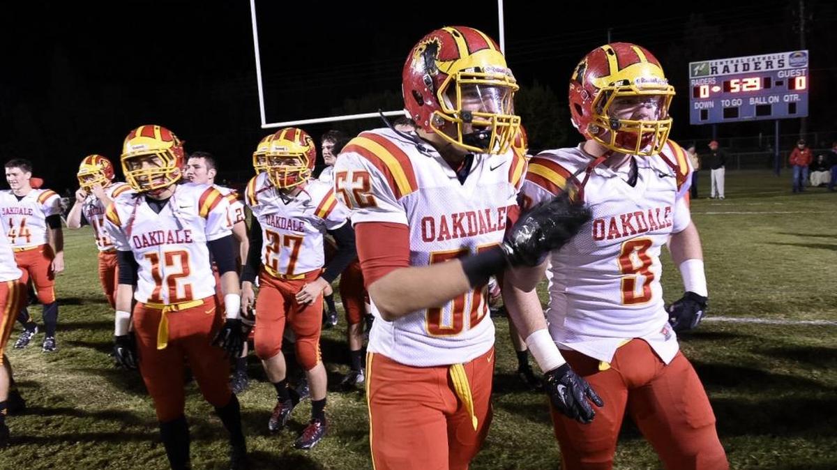 Oakdale high school football players Louis Marcella (52) and Greg Hickman (9) get pumped before the game against Central Catholic high school Friday evening (11-06-15) at Central Catholic in Modesto, Calif.