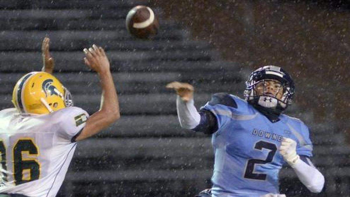 
Downey Quarterback Paul Wilson releases the ball throwing a pass during a game between Davis and Downey on October 31st at Downey High School.
