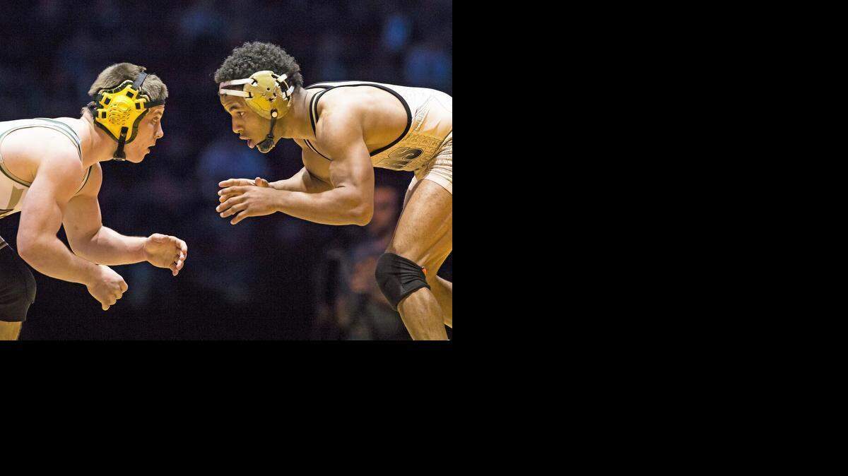 
Enochs High's McCoy Kent, right, and Paradise's Wyatt Wyckoff go head-to-head in the 138-pound division final at the CIF State Wrestling championships Saturday night at Rabobank Arena in Bakersfield. 
