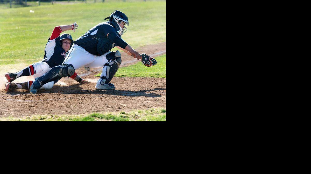 
Downey catcher Jose Acosta forces out Beyer runner Jack Large during the Modesto Metro Conference game at Beyer High School in Modesto, Calif., on Wednesday, March, 18, 2015. Beyer won the game 5-4.
