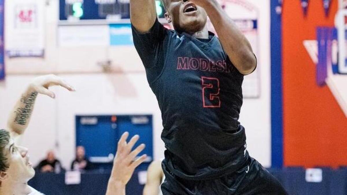 Modesto's Qimonni Myers scores during the 17th Holiday Hoop Classic game with Freedom at Modesto Christian High School in Salida, Calif., on Tuesday, Dec. 27, 2016.