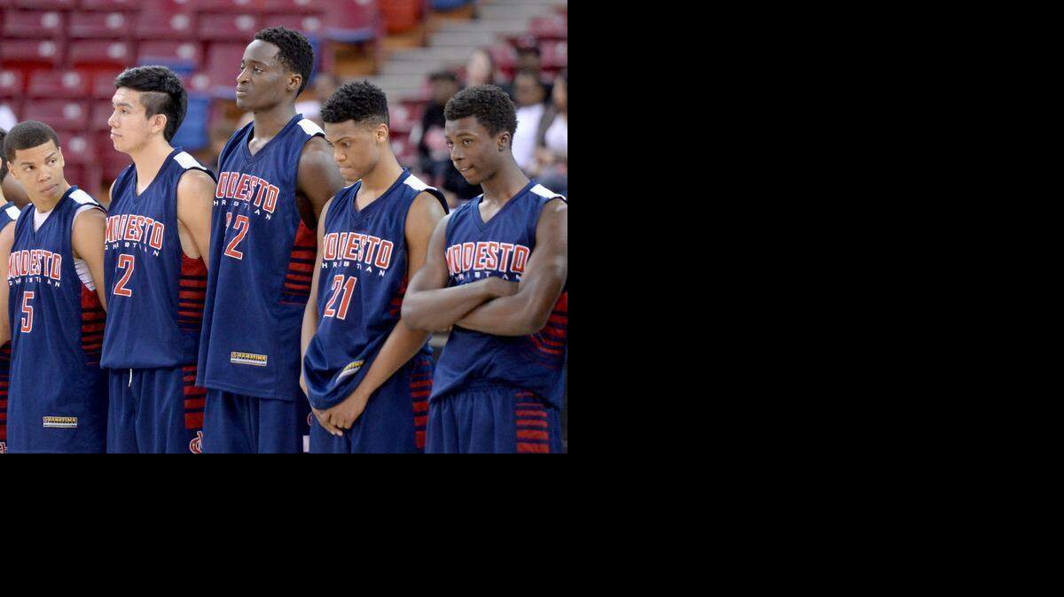 Modesto Christian players stand after the loss to Bishop O’Dowd in the the NorCal Open Division title game.