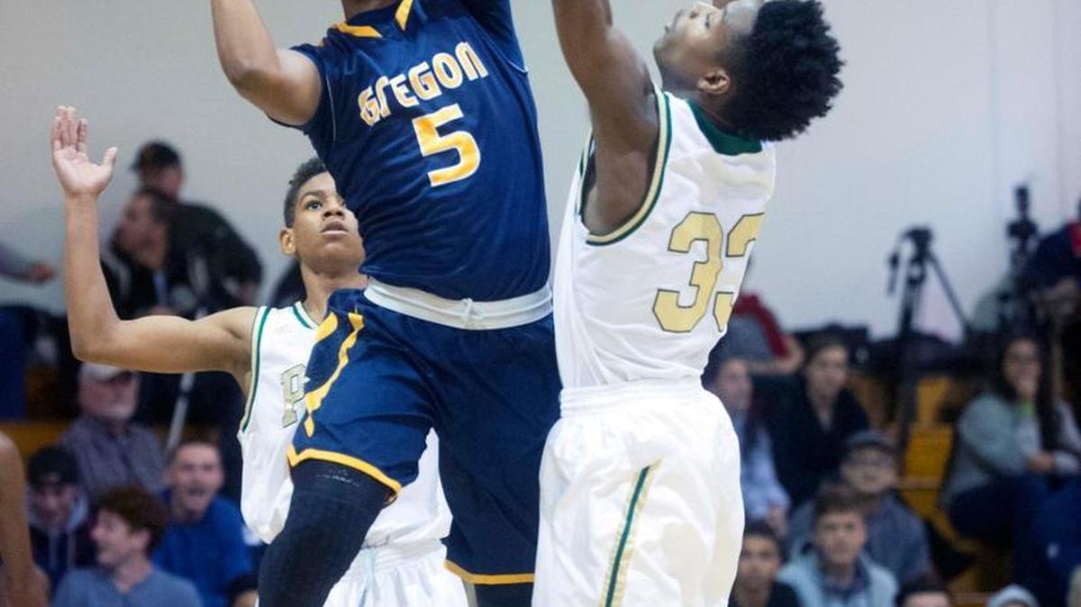 Gregori guard Uhan Clarke (5) goes up for a layup during a game between Gregori and Long Beach Poly in the 16th annual Modesto Christian Holiday Hoop Classic in Modesto on Saturday.