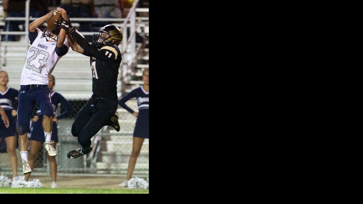 
Downey cornerback Jakob Magana intercepts a pass in front of Enochs receiver Caden Rico in October.
