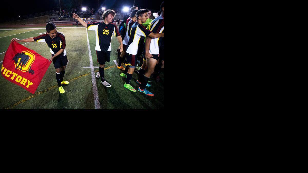 
Oakdale High players celebrate their 3-1 victory over Patterson in the Division III Sac-Joaquin Section semifinal playoff game at Patterson High School in Patterson, Calif., on Wednesday, November 12, 2014.
