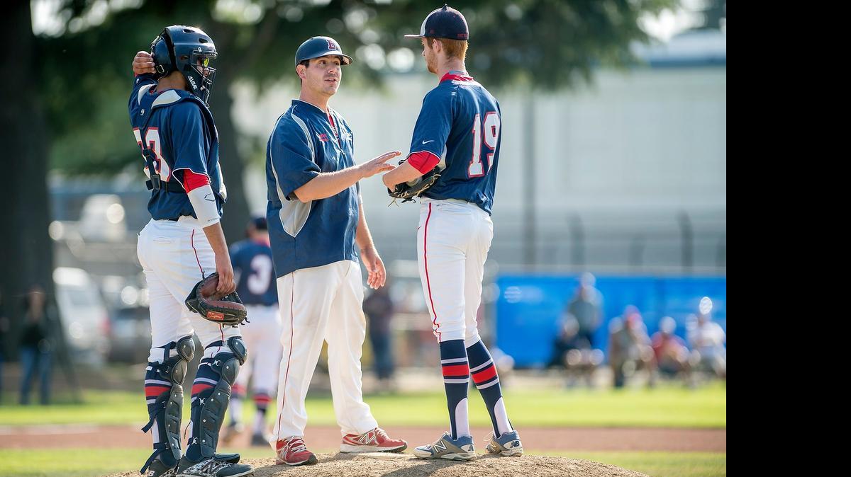 
Beyer coach Dom Duran talks with pitcher Micah Hall and catcher Anthony Enwiya during a seeding playoff game at Downey High School in Modesto, Calif., on Wednesday, May, 6, 2015. Beyer won the game 2-0.
