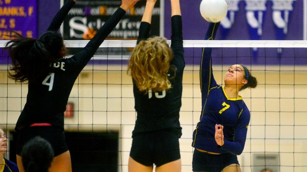Turlock High’s Jazmyn Tubbs (7) hits the ball past two Pitman defenders during the Sac-Joaquin Section Division I volleyball final Nov. 12 at Tokay High in Lodi. Tubbs and the Bulldogs, who gained an at-large bid into the CIF NorCal regional tournament, have not dropped a set since falling to Pitman. They take on Menlo-Atherton on Tuesday.