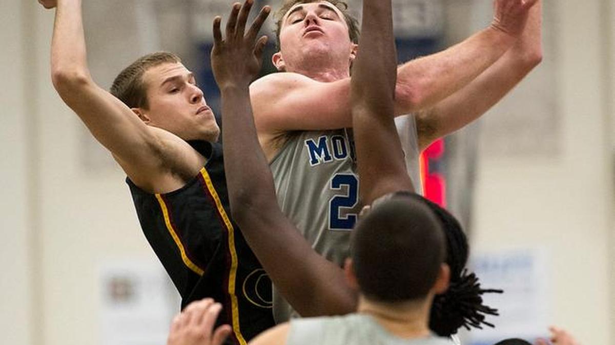 MJC forward Joe Hamilton scores two during the Big 8 Conference game with Sacramento City at Modesto Junior College in Modesto on Friday, January, 9, 2015. MJC won the game 66-61.