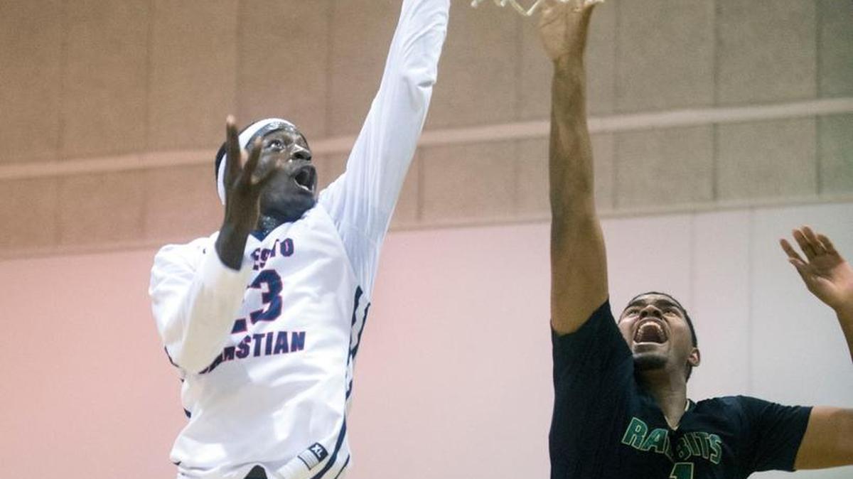 Modesto Christian Robinson Idehen lays the ball up during a game between Modesto Christian and Long Beach Poly in the championship of the 16th annual Modesto Christian Holiday Hoop Classic on Wednesday, Dec. 30, 2015.