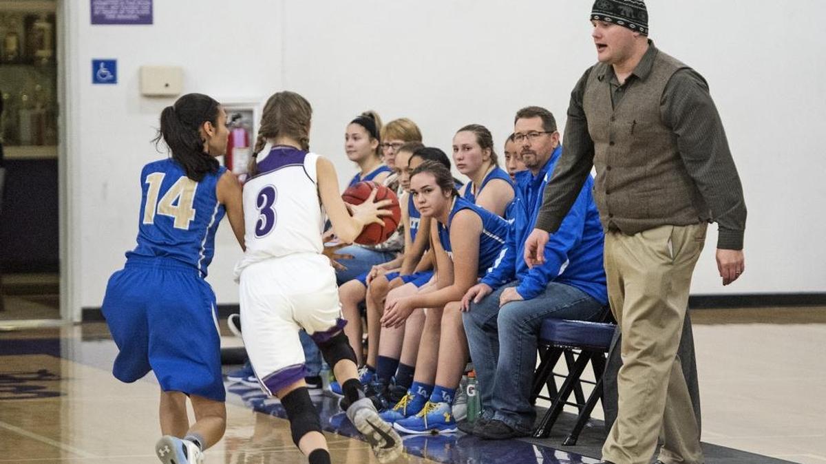 Waterford coach Joshua Whitfield watches as the Wildcats’ Karina Lupercio (14) defends Denair’s the action during the Southern League game with Denair at Denair high School on Thursday, Jan. 4, 2018.