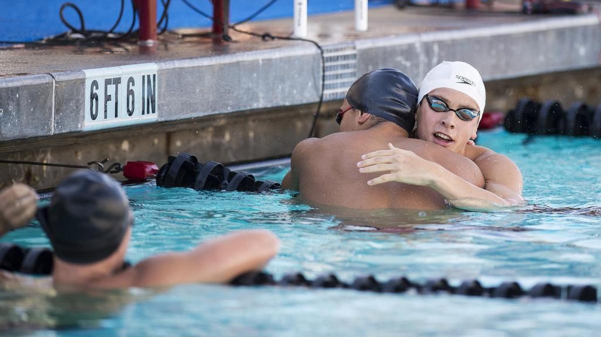 Gregori High School junior Andrew Britton, right, hugs Ripon junior Ty Wells, left, after winning the boys 100-yard Breaststroke finals during the CIF State Swimming and Diving Championships at Clovis West High School in Fresno, Calif., on Saturday, May 20, 2017. Britton finished with a time of 54:94.