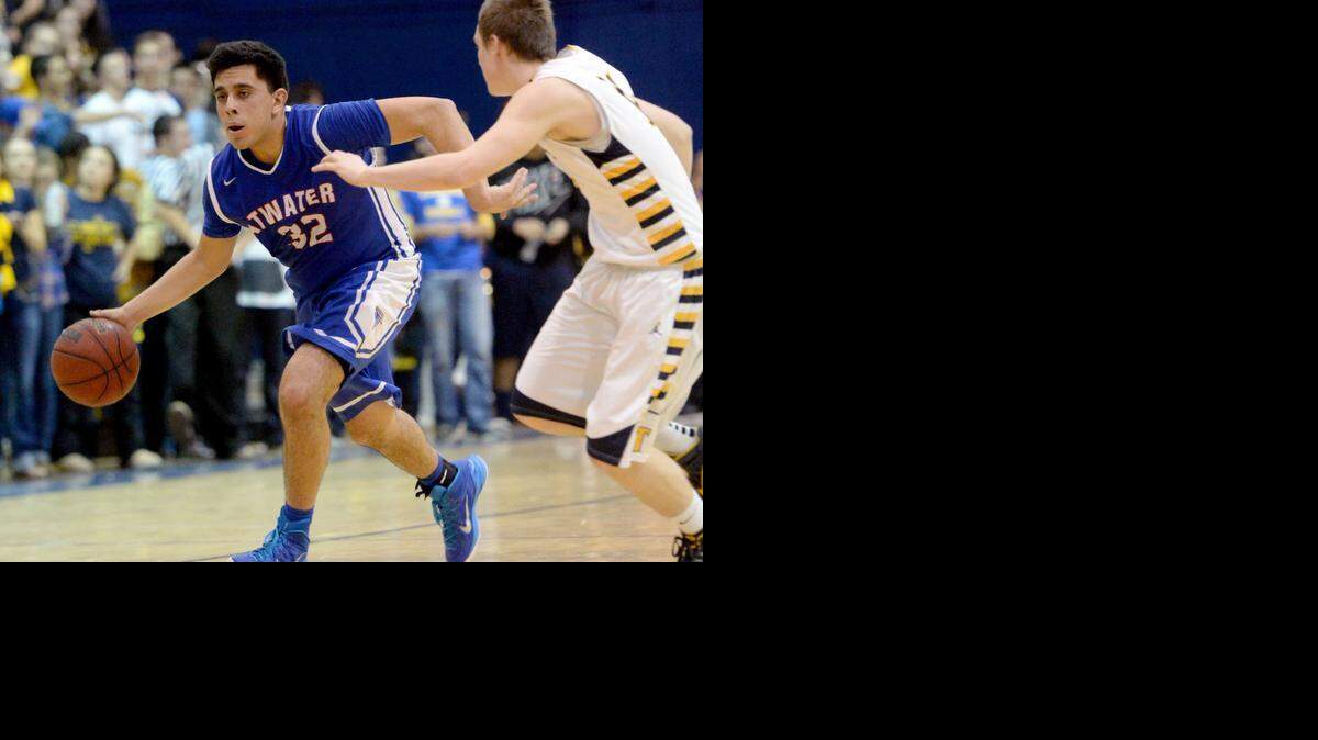 
Atwater guard Alex Chavez dribbles past a Turlock defender during a game between Turlock High School and Atwater High School in Turlock on January 28th
