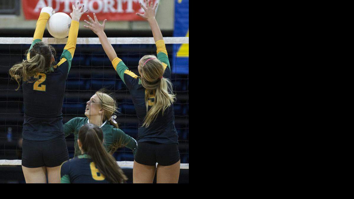 
Hilmar's Whitney Williams ball is blocked by Sonora's Savannah Lawrence (2) during the CIF Sac-Joaquin Section Division IV Championship game in Davis, Calif., on Friday, Nov. 21, 2014.
