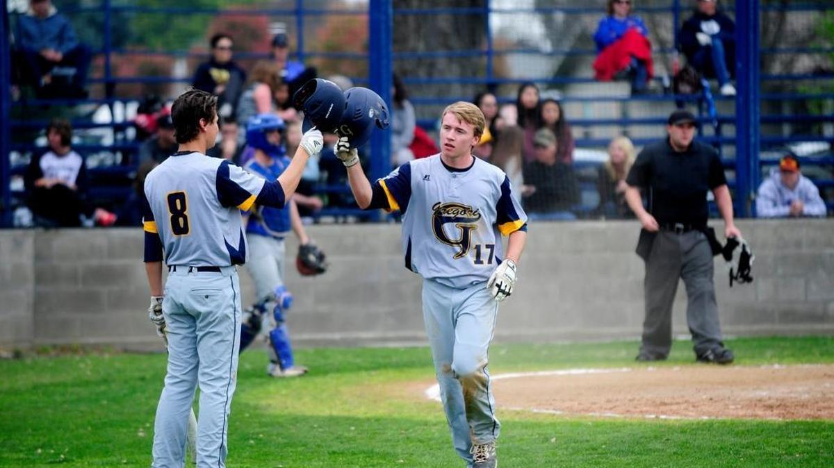 Gregori’s Tyler Vandemark (17) scores a run and touches helmets with Matt Dallas (8) during a game at the Pedretti Baseball Tournament at Turlock High School on Thursday, March 10, 2016. Gregori is No. 5 in the large-school rankings this week.