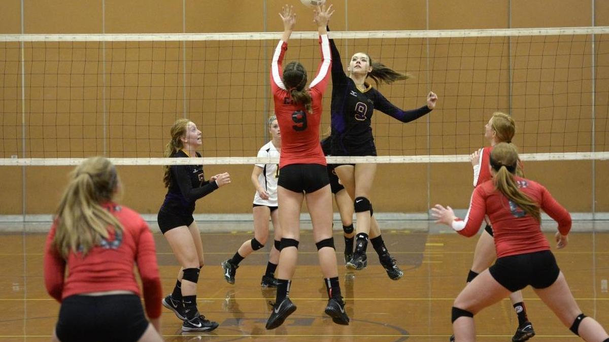 
Escalon's Jaden Scott floats the ball over the net as Ripon's Breana Barrios defends during the Trans-Valley League match in Escalon, Calif., on Wednesday, September, 23, 2015. Escalon won the match 18-25, 25-21, 15-25, 25-21, 15-9.
